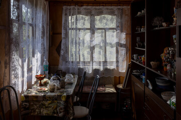 Dubna, Moscow region, Prislon village, July 20, 2025, Cozy Nostalgic Dacha Kitchen: Wooden Table, Oilcloth, and Soviet Memorabilia