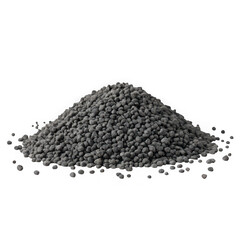 A small pile of dark gray granular fertilizer or plant nutrient pellets isolated on transparent background