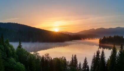 Fototapeta premium tranquil sunrise over a calm lake surrounded by misty mountains and evergreen trees