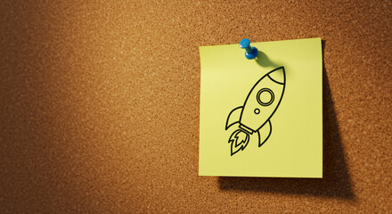 Rocket doodle on yellow sticky note pinned to corkboard background  