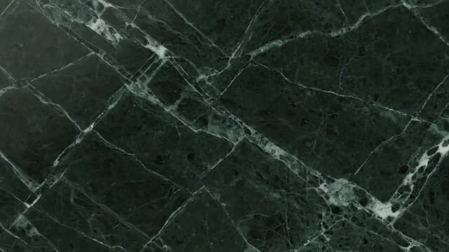 Dark green marble slab with white veins forming a fractured pattern