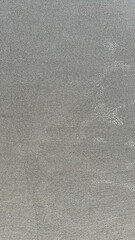 full frame photo of wet gray sand beach texture background