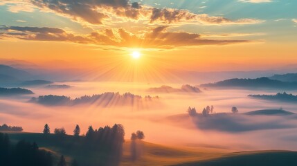 Golden sunrise illuminating rolling hills and misty valley