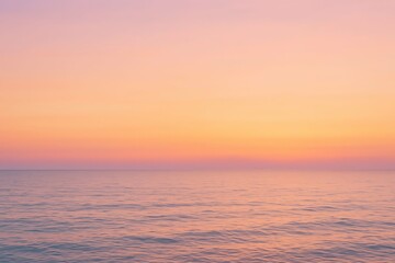 Fototapeta premium Golden sunlight kisses the waves as the sun dips below the horizon, painting the evening sky with a beautiful blend of orange, red, and blue clouds over the ocean
