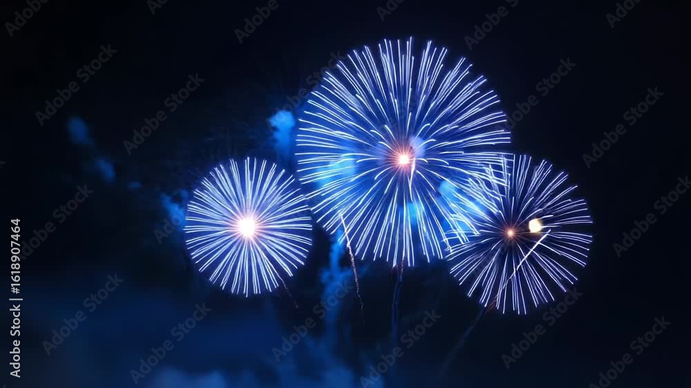 Poster brilliant blue fireworks explode in the dark night sky, creating a dazzling display of light and col