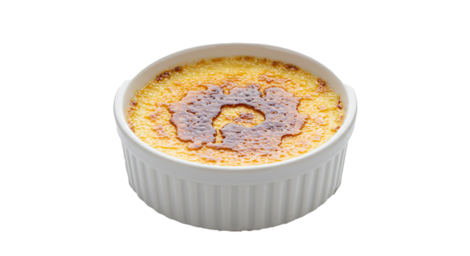 A single ramekin of crème brûlée with a caramelized sugar crust on a black background isolated on transparent background