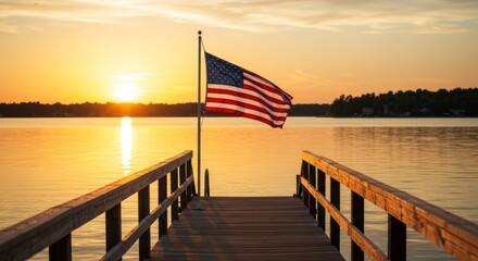 Small American flag on a flagpole blowing in the wind at the beach on a pier Sunset 