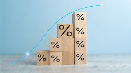 Wooden blocks with percentage signs stacked in a rising graph with a blue curve