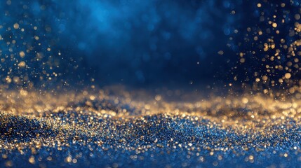 Golden glitter sparkles on blue background Abstract luxury texture,