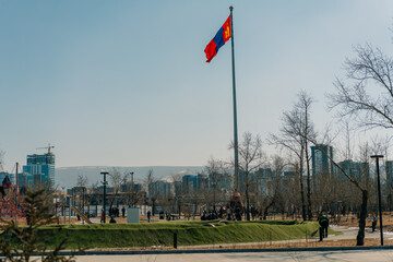 Fototapeta premium Mongolia flag waving on sundown sky