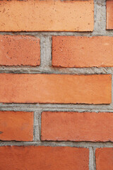 Red and orange brick wall texture. Perfect for backgrounds, construction, or architecture-themed...