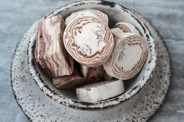 Uzbek cuisine Halva Sweet and nutty confectionery product. Halva is a dense, sweet confection made from ground sesame seeds or sunflower seeds combined with sugar . Round halva.