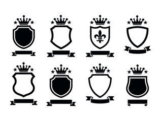 Vector art of a collection of black shields with crowns and banners isolated on white background, ideal for heraldic emblems