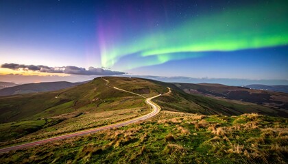 Mountain road under aurora borealis