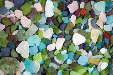 background of scattered multi-colored glass pebbles/