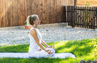 fit woman dong yoga on green background