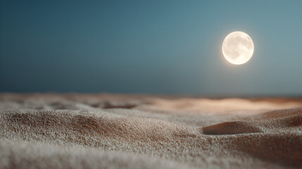 Serene landscape of a sandy expanse under a bright full moon against a dusky blue sky at twilight.