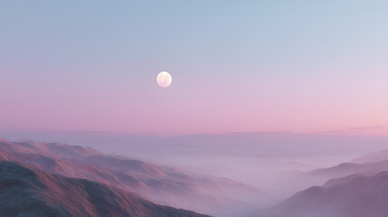 Fototapeta premium A serene landscape of mountain ranges shrouded in mist under a pastel sky with a bright moon.