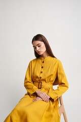 Elegant Woman in Mustard Yellow Dress - Studio Portrait
