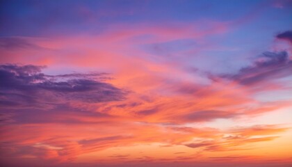 Obraz premium vibrant sunset sky with orange and purple cloudscape pastel hues at dawn or dusk