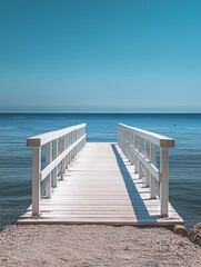 Serene White Wooden Pier Extending to a Calm Blue Sea Under Clear Sky