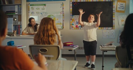 Primary School Boy Showcasing Knowledge of Ecology in Front of Class and Female Teacher. Smart Kids...