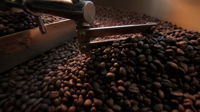 Dynamic coffee bean roasting process showcasing rich texture and slow move movement, sunlight.