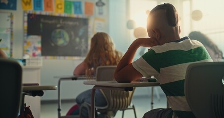 Elementary School Students Sitting and Writing Exam on Renewable Energy Resources in Modern...