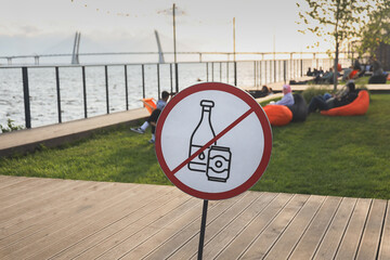 Sign prohibiting drinking alcohol in park on seashore