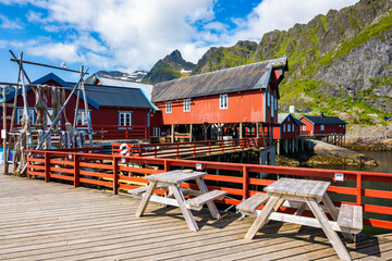 Typical traditional houses in A port and fishing village in summer mountain landscape, Lofoten Islands, Norway © pkazmierczak
