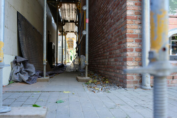 Construction Scaffolding by White Building with Urban Gravel and Debris at wyk on foehr island