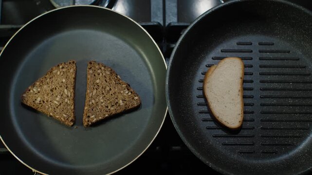 Experience the fascinating art of toasting as two distinct types of bread are beautifully grilled to perfection in a pan. Easy tutorial aims to enhance your cooking skills in a delightful way