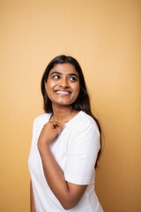 Smiling Indian Woman Looking Up with a Playful Expression