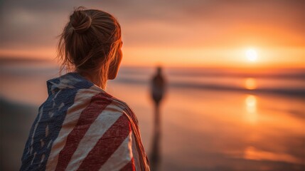 Woman Wrapped in Flag Watching Sunset on Beach