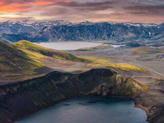 Aerial View of Icelandic Crater Lake and Snow Capped Mountains at Sunset