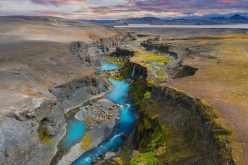 Sigoldugljufur Canyon with Turquoise River and Waterfalls at Sunset