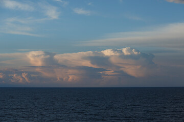 Cloud formations over the North Sea capture a serene moment during twilight hours, highlighting nature's beauty and tranquility