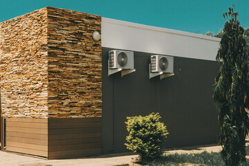 A modern house brick wall concept with colorful colors and green plants 