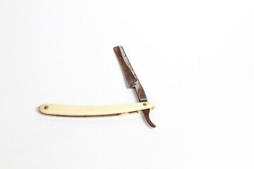 rusty straight razor isolated white background.