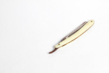 rusty straight razor isolated white background.