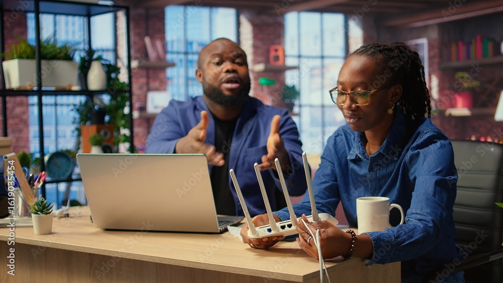 Poster discouraged african american couple struggles with an unstable wi fi network, getting angry while th