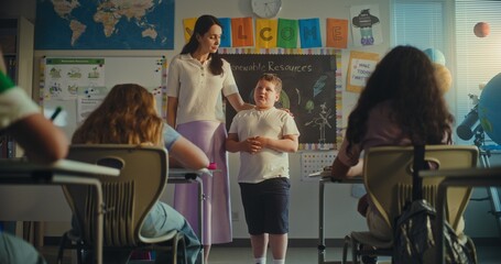 Shy Primary School Boy Showcasing Knowledge of Ecology in Front of Class Full of Kids in Modern...