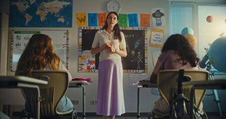 Dolly Shot of Female Teacher Starting Lesson, Teaching Ecology to Primary School Children in Modern...