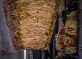 Seasoned lamb roasting for doner kebabs, popular street food, Istanbul Turkey