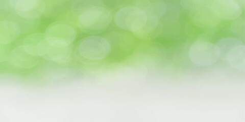 Obraz premium Blurred Light Green Abstract Background with Soft Glow and Nature Inspired Bokeh