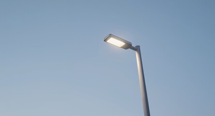 Modern LED Street Light Illuminating Clear Blue Sky  Urban Lighting Solution with Bright Fixtu
