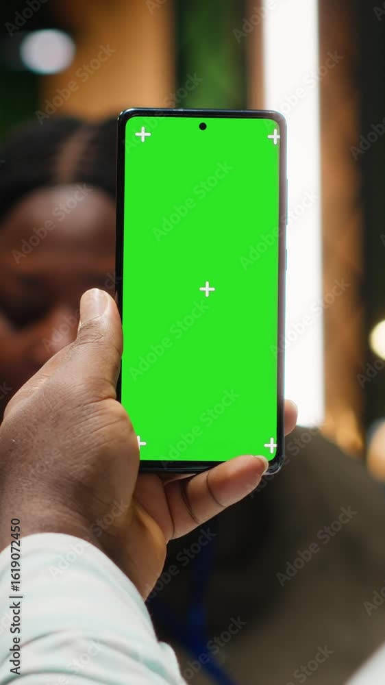 Poster Vertical Video Diverse business team hosting a meeting with chroma key on device, late night briefing conference to discuss budget updates and performance metrics. Align company objectives for vision