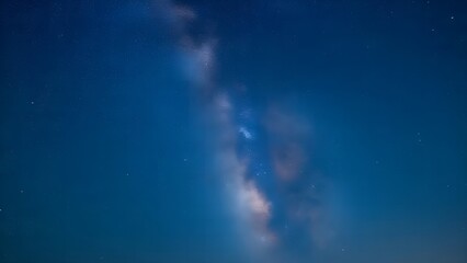At night, the stars shine in the clear, cloudless sky.