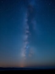 At night, the stars shine in the clear, cloudless sky.