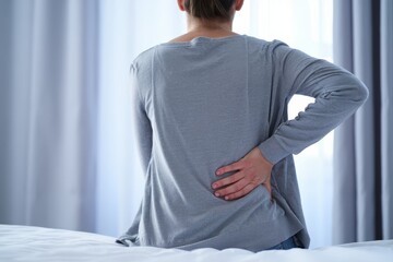 Back pain relief woman holding lower back spine injury medical condition concept idea
